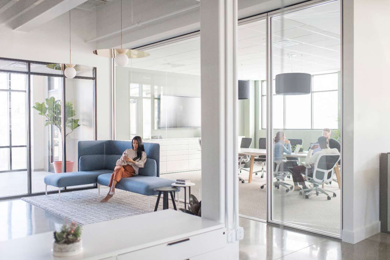 Law firm client reception area designed to balance hospitality-forward aesthetics with confidentiality protection