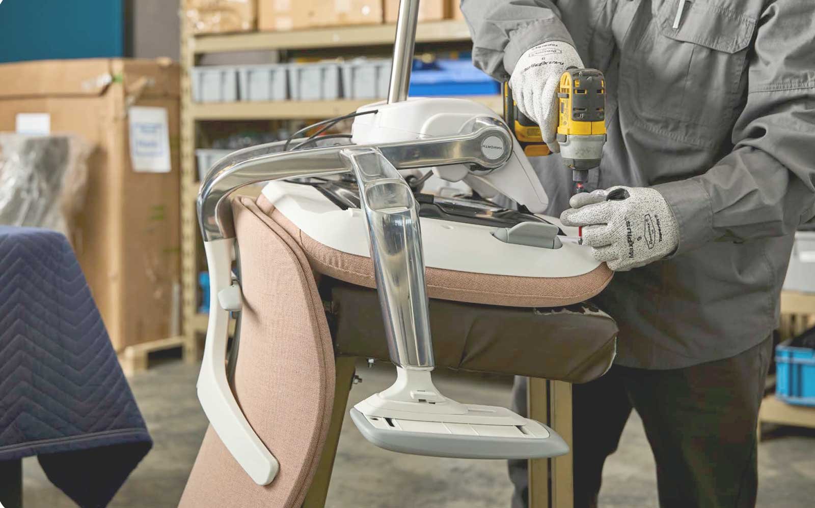 Unisource Solutions employee repairing furniture as part of sustainability initiative